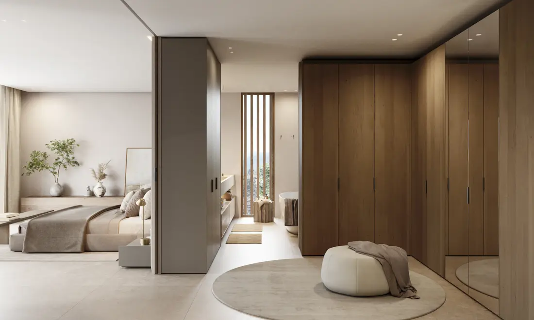 Dormitorio principal de un ático con el vestidor de madera abierto