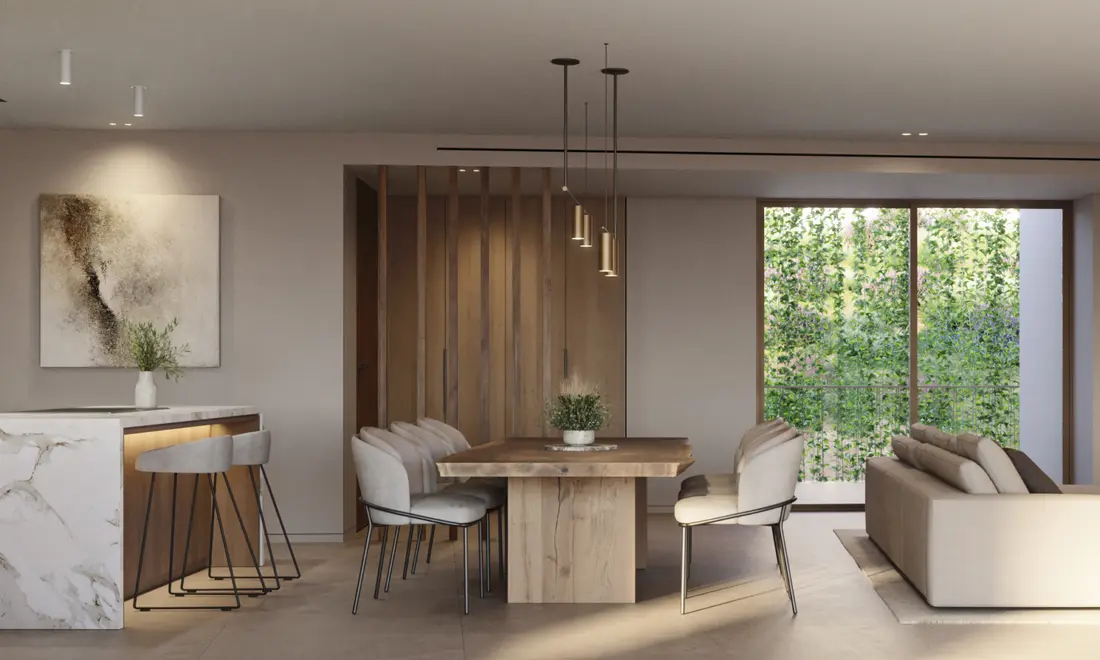 Cocina y comedor de una vivienda tipo, abiertos al jardín