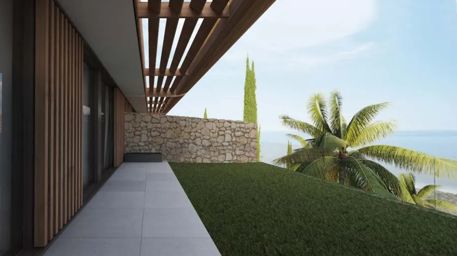 Rendering af en terrasse med pergola af trælister og stenmur, med havet i baggrunden